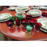 A selection of red and green glassware including sundae dishes and Port glasses