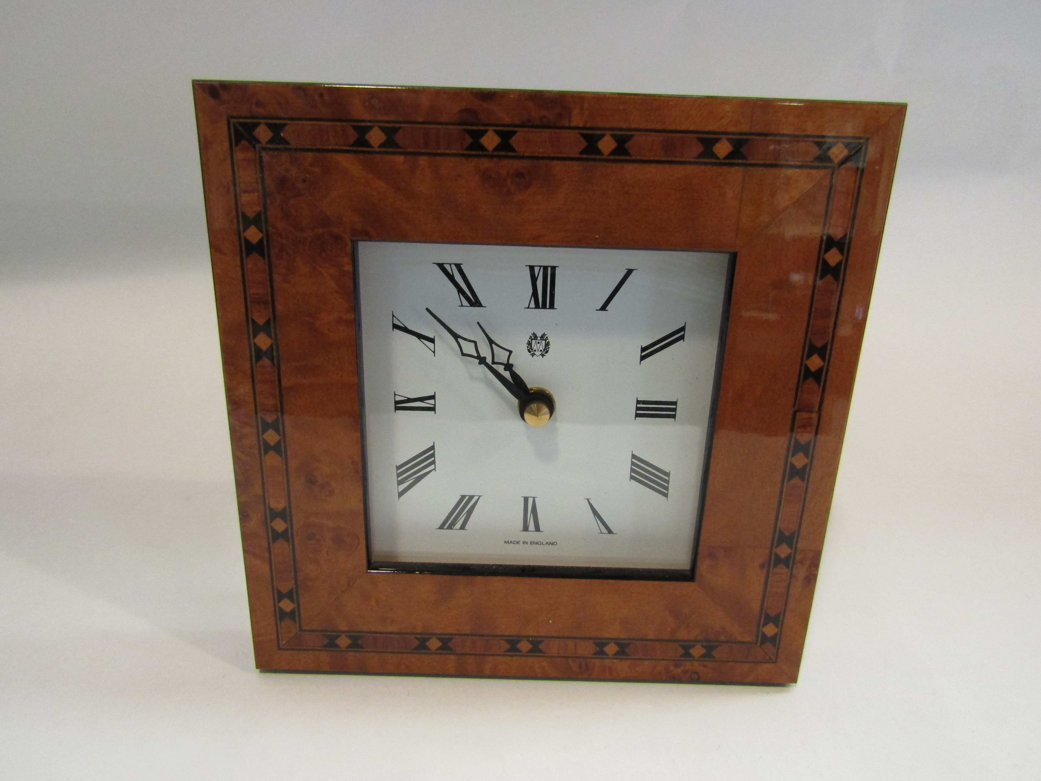 A Kienzle marquetry framed clock