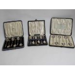 Three cased sets of six silver teaspoons including apostle handled,