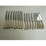 A set of eight William Yates Ltd silver handled dinner and dessert knives,