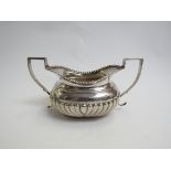 A Maurice Freeman silver twin handled sugar bowl, fluted detail, London 1900,