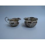 Atkin brothers silver embossed cream jug and sugar bowl Sheffield 1900 (2) 147g (split to lip of