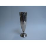 A Walker & Hall silver vase with weighted base, pieced frieze, dent to lip, Sheffield 1924,