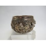 A Burma of Thai (?) white metal pot with deep relief of deities and figures amongst foliage, 436g,