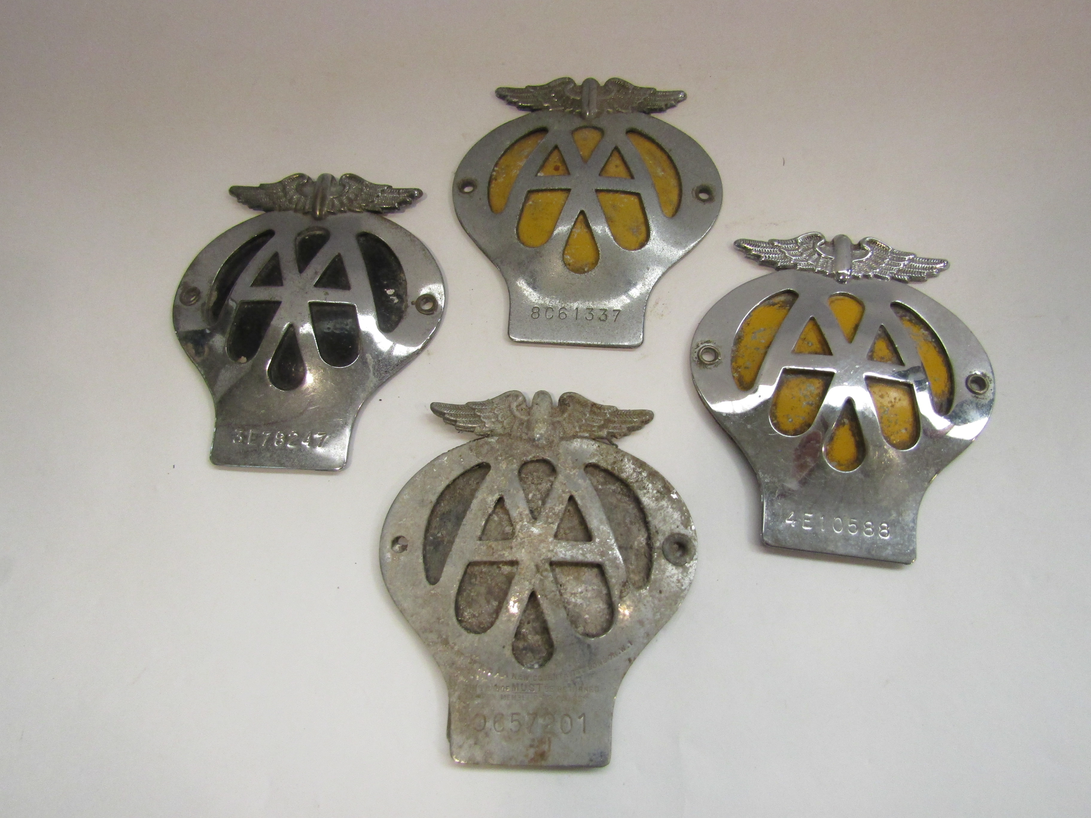 Four AA badges including eagle crested