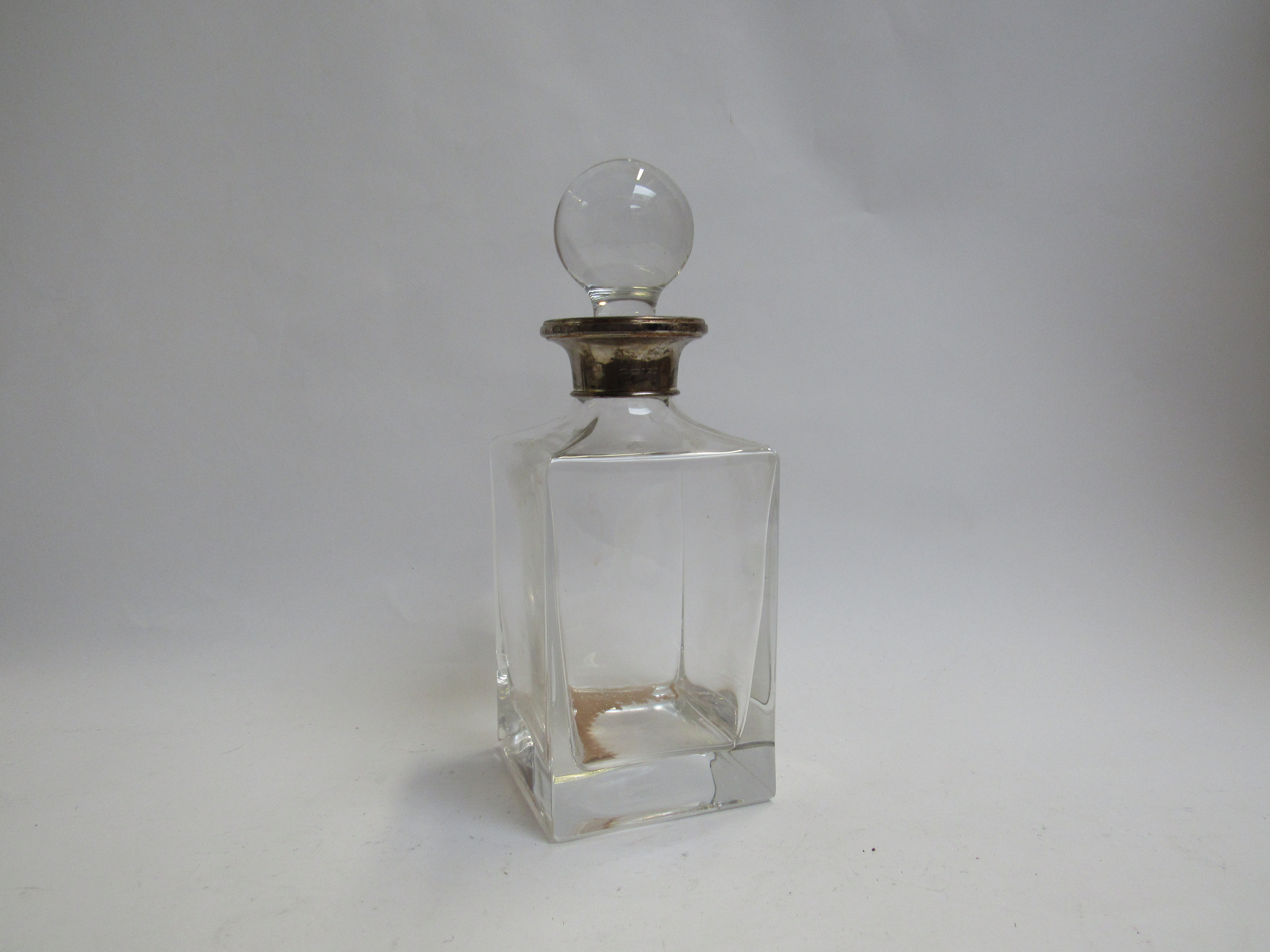 A square form decanter with silver collar,