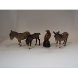 Four pieces of Beswick: two donkeys, one a/f - missing an ear,