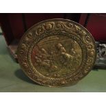 An embossed brass tavern charger,