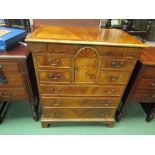 A 17th Century revival walnut chest of four short over three graduating long drawers,