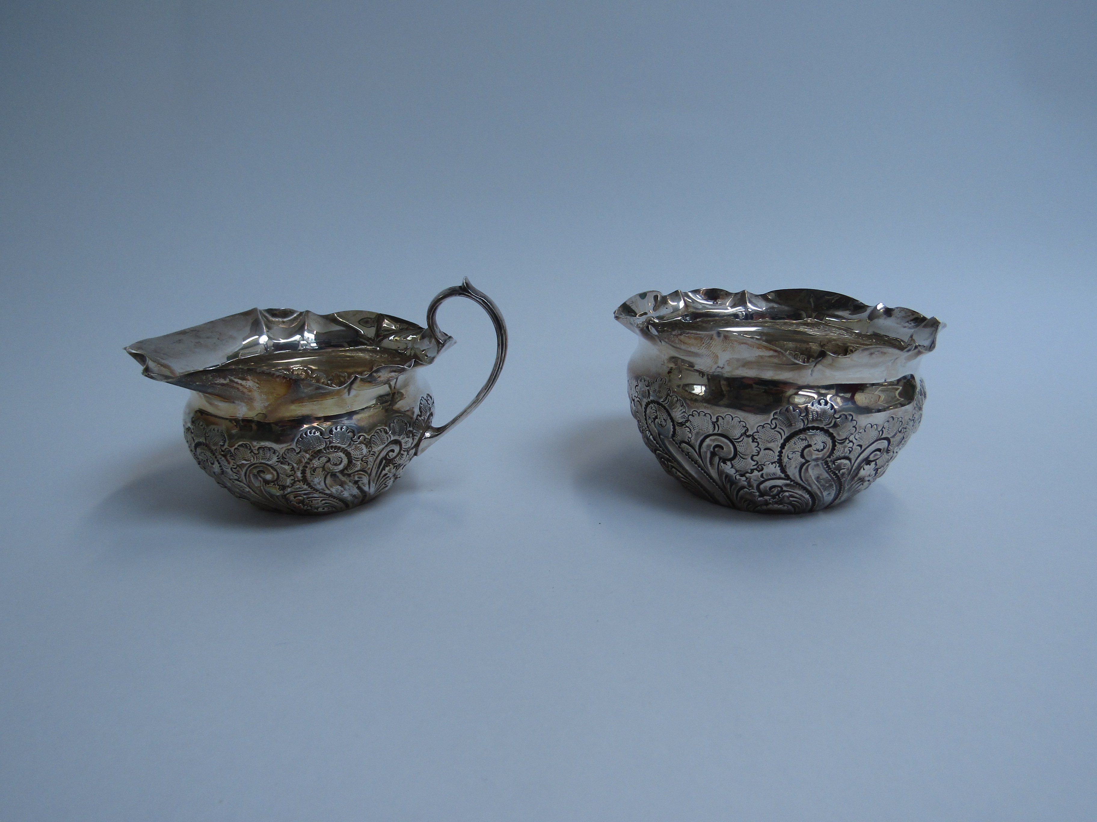 Atkin brothers silver embossed cream jug and sugar bowl Sheffield 1900 (2) 147g (split to lip of - Image 2 of 3