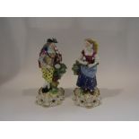 A pair of early 20th Century Continental polychrome porcelain figures of male and female musicians