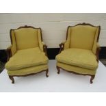 Two French armchairs with feather filled cushion,