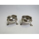 A pair of George III silver salts, fluted rim, shell footed base, marks rubbed,