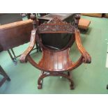 A 19th Century walnut Savonarola chair with carved decoration,