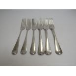 Seven Georgian and later silver serving spoons including London 1804, some with monogrammed handles,