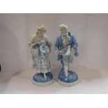 A large pair of late 19th Century bleu de ciel and white Continental porcelain Dresden type figures