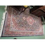An Indo Chakhari wool rug, multiple blue and terracotta borders,