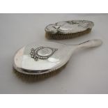 A silver Williams Art Nouveau brush marked Birmingham and another silver backed brush marked