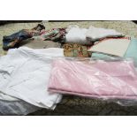 A large selection of table and bed linens, crochet cloths, fabric remnants, cotton sheets,