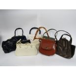 A good quantity of mainly 1950s handbags in various colours,