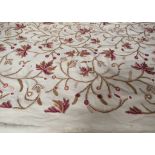 A modern Kashmir crewel work embroidery, beige ground with tones of puce and ginger,