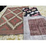 An ethnic quilted throw depicting horses,