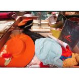 A box of costume accessories including hats, gloves,