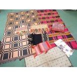 Two ethnic woven cotton throws of square and rectangular form, black, orange,