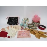 A range of fashion accessories including a pink nylon shower cap, various pairs of gloves,