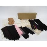 A quantity of 1950s and 60's lady's fashion gloves in kid leather and fabric, various colours,