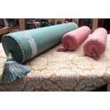 Three silk baluster cushions, two in pink, one in green, pink bolster cushions,
