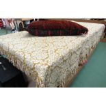 An Eastern carpet floor pillow/ cushion and large tasselled throw