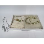 A 1940's wedding veil, waxed floral headdress, gloves and stockings, boxed.