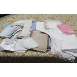A box containing a large quantity of cotton and linen table cloths, napkins,