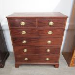 A late Georgian tall mahogany split chest of two short over four graduated drawers on bracket feet.