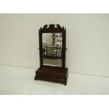 A George II mahogany dressing table mirror the rectangular plate with moulded frame surmounted by