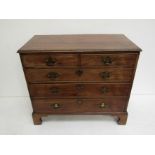 A George III mahogany chest with walnut crossbanding,