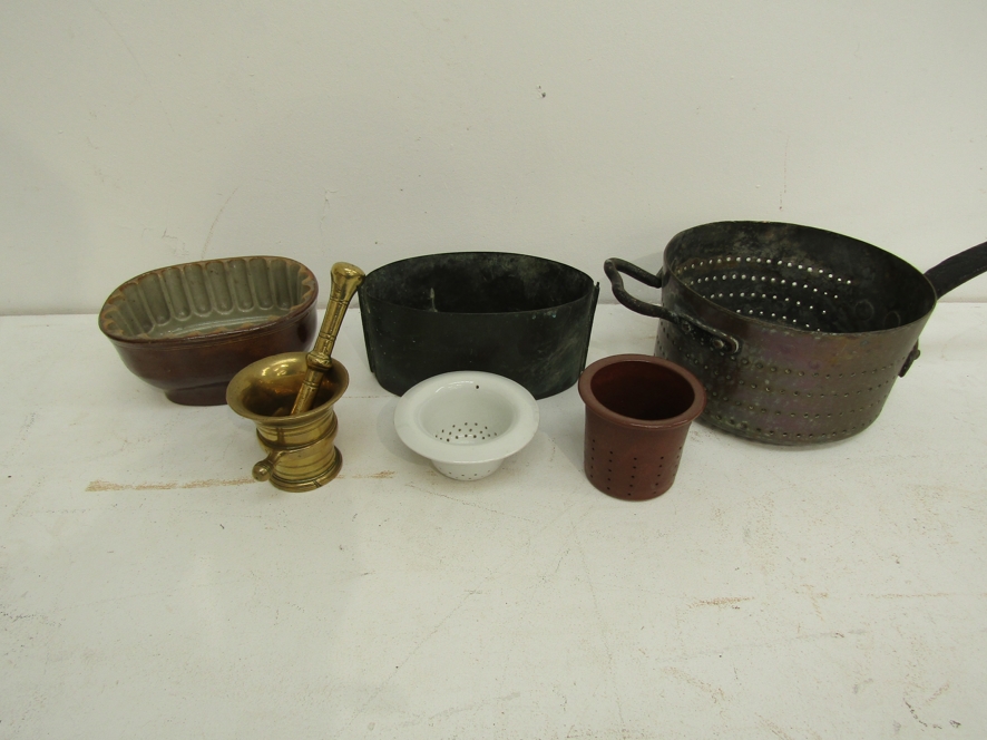 Kitchenalia: A collection including a Georgian copper saucepan colander, an oval copper press,