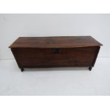 An 18th century oak six plank coffer with shaped end boards,