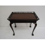 A George II style mahogany silver table with a canted pierced fretwork gallery and blind fretwork
