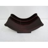 A Regency mahogany cheese coaster, the dipped and divided interior with baluster turned ends,