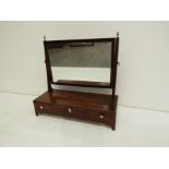 An early 19th century mahogany and crossbanded toilet miror,