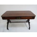 A Regency brass-inlaid rosewood writing table,