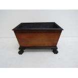 A George III mahogany wine cooler with the original lead liner,