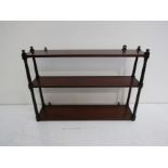 A set of early 19th century mahogany wall hanging shelves,