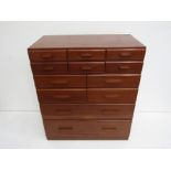 A cedar chest of drawers with a capacious arrangment of twelve drawers arranged as two rows of