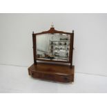 A Regency mahogany dressing table mirror, the rectangular plate surmounted by three finials,