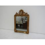 An 18th century French mirror in the rococo style,