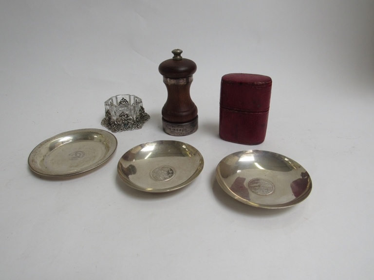 A quantity of silver and white metal pin dishes,