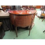 An Edwardian cross banded mahogany bow front sideboard the single door with working key over spade